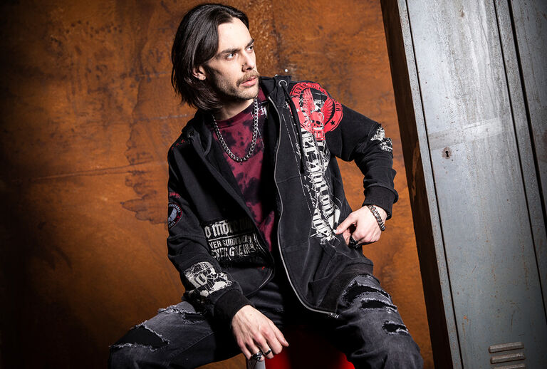 Original Sinner / This isn&rsquo;t about playing it safe. The Original Sinners collection stands for rock (and biker) inspired streetwear: raw, rebellious, and authentic. Dark, washed-out color palettes, used effects, and tattoo aesthetics form a clear design language. Skulls, wings, crosses, and heraldic elements meet vintage-inspired typography, each piece feels like a statement item with strong recognition value.Elaborately executed prints, from front prints to all-over designs, blend with embroidery, patches, and textured surfaces. Lacing, bands, raw edges, and destroyed details add depth and attitude, while tie-dye and acid-wash effects create a distinctive patina. The silhouettes are proven and precisely cut: fitted T-shirts and longsleeves, along with layering pieces like hoodies, zip jackets, and vests. For women, tailored with subtle feminine accents; for men, masculine and body-defining. Classic fits, refined for a modern edge.Original Sinners is rockwear with character, uncompromising in style, high-quality in execution, and far removed from short-lived trends. For those who don&rsquo;t need to explain their look, they wear it. Timeless rock styles, reinterpreted for today and made for the street. Original Sinners : made for the unapologetic. / Discover now!