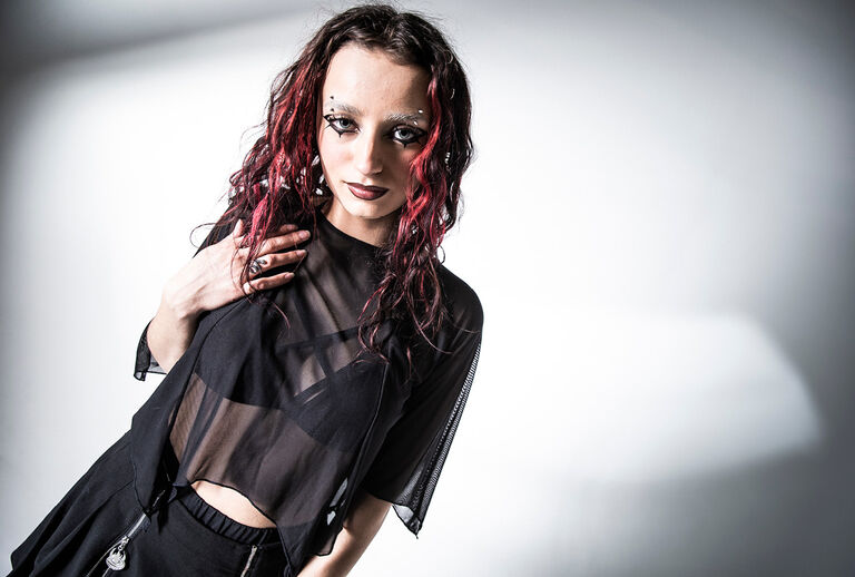 The Void / This collection transports you into the world of nu-goth aesthetics: deep black, occult and characterised by hand-drawn symbols, all-over eye prints and mystical illustrations. Inspired by Nietzsche's quote, &lsquo;If you look long enough into the void, the void begins to look back through you,&rsquo; the result is a look that seems as if the abyss itself is staring back.Oversized silhouettes, distressed details, fine mesh elements and metallic accents form a modern, dark witch attitude. Illustrative motifs, chains and floating, partly distressed knit structures combine fashion pieces with the cool, dark atmosphere of the nu-goth style &mdash; without becoming romantic, but rather raw, cool and enigmatic. / Discover now!